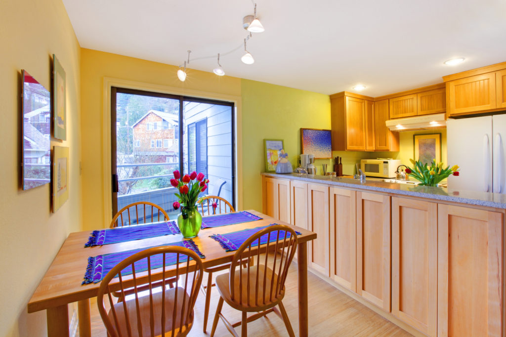 Yellow happy dining table and apartment kitchen